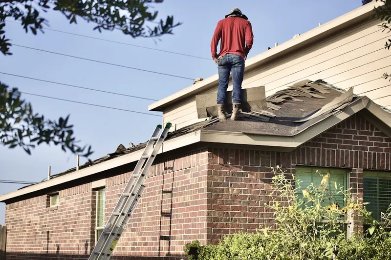 Professional roofer working on a residential roof in Sandstone Canyon